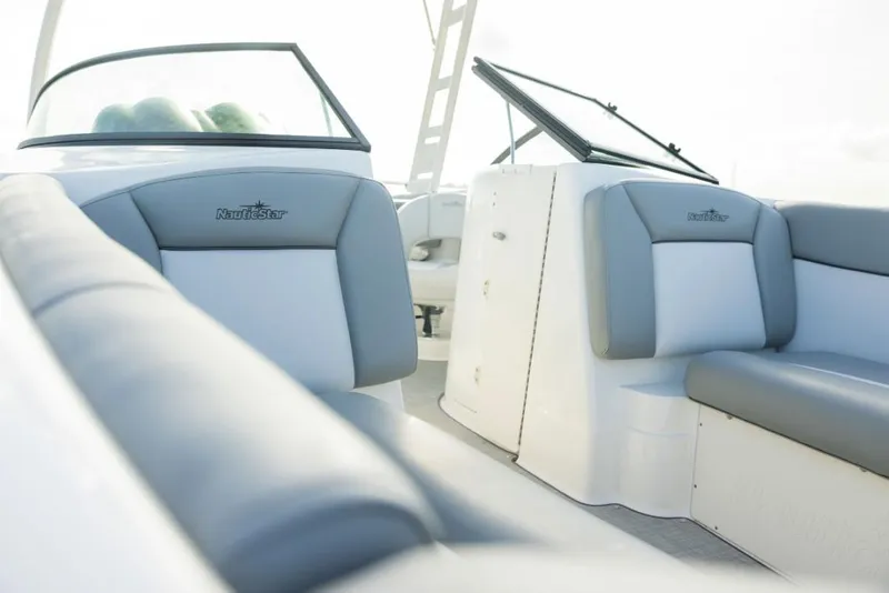 Slide: The Image of Manufacturer Provided Image: 2022 NauticStar 243 DC boat interior with grey and white seating. - 3