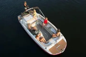 Slide: The Image of 2017 Starcraft Star Step 221 OB boat with passengers on calm water. - 12