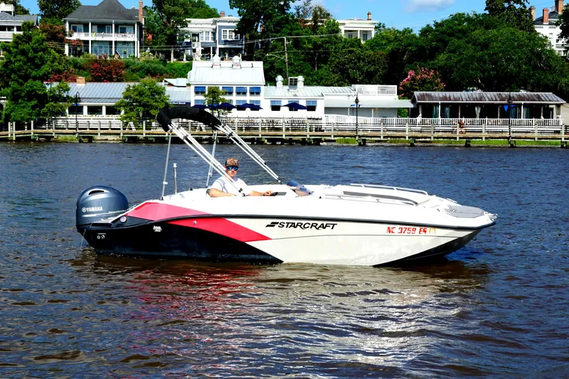 Slide: The Image of 2017 Starcraft Star Step 221 OB boat on water, with scenic background. - 6