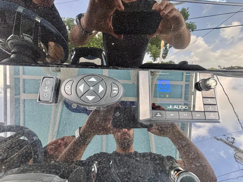 Slide: The Image of Control panel of a 2007 Midnight Express 39 Cuddy boat with JL Audio system. - 21