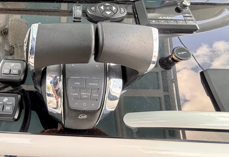 Slide: The Image of Throttle controls on a 2007 Midnight Express 39 Cuddy boat dashboard. - 22