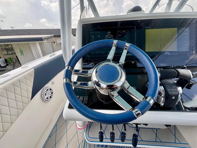 Slide: The Image of Steering wheel and dashboard of 2007 Midnight Express 39 Cuddy boat. - 24