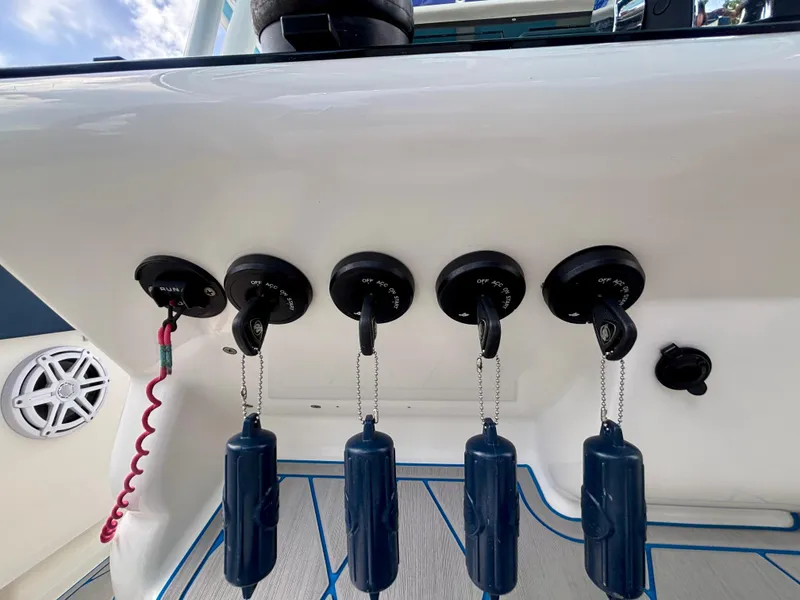 Slide: The Image of Control panel of a 2007 Midnight Express 39 Cuddy boat with ignition switches. - 25