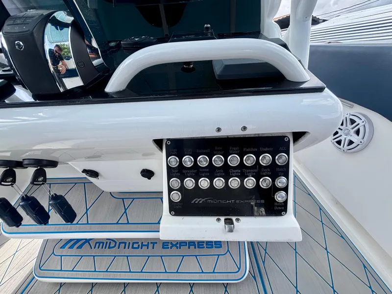 Slide: The Image of Control panel of a 2007 Midnight Express 39 Cuddy boat with labeled switches. - 26