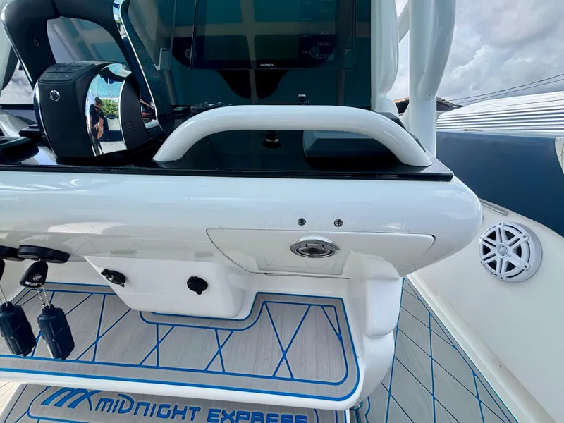 Slide: The Image of 2007 Midnight Express 39 Cuddy boat interior with control panel and branded flooring. - 27
