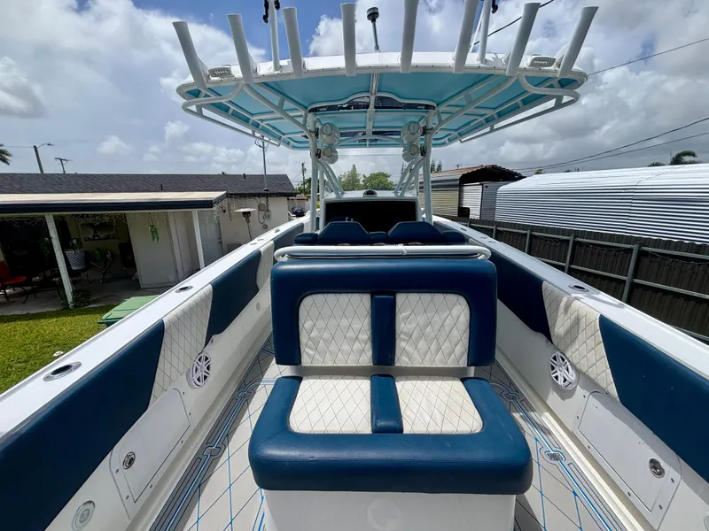 Slide: The Image of 2007 Midnight Express 39 Cuddy boat interior with blue and white seating. - 33