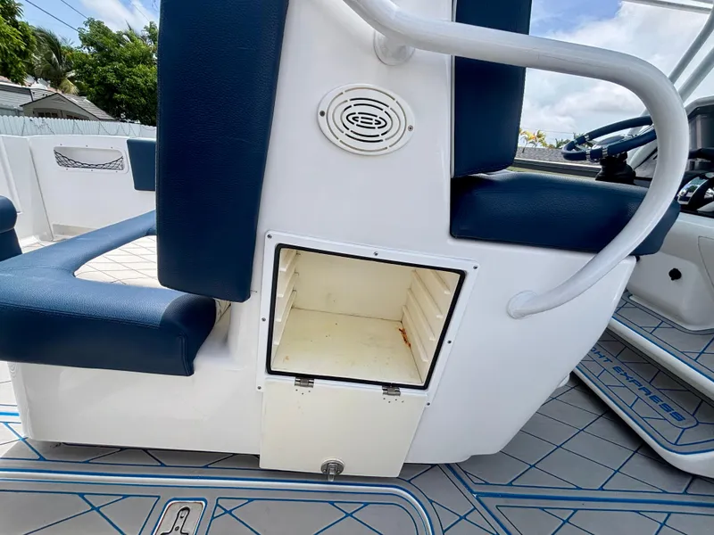 Slide: The Image of 2007 Midnight Express 39 Cuddy boat interior with open storage compartment and blue seating. - 37