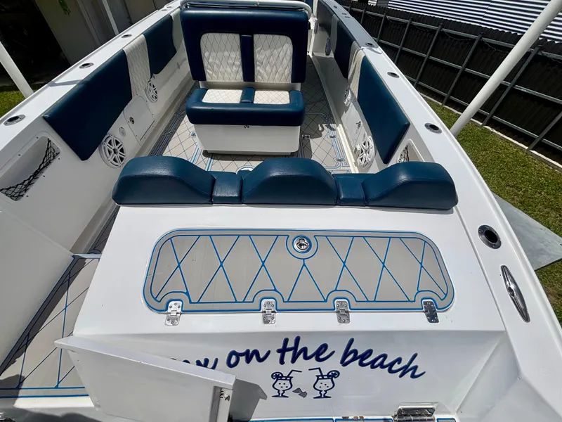 Slide: The Image of 2007 Midnight Express 39 Cuddy boat interior with blue and white seating and custom flooring. - 41
