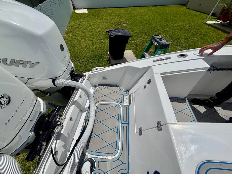 Slide: The Image of 2007 Midnight Express 39 Cuddy boat with Mercury FourStroke engines, docked on grass. - 45