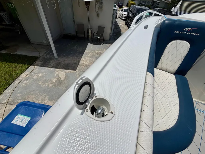 Slide: The Image of 2007 Midnight Express 39 Cuddy boat interior with seating and deck details. - 46