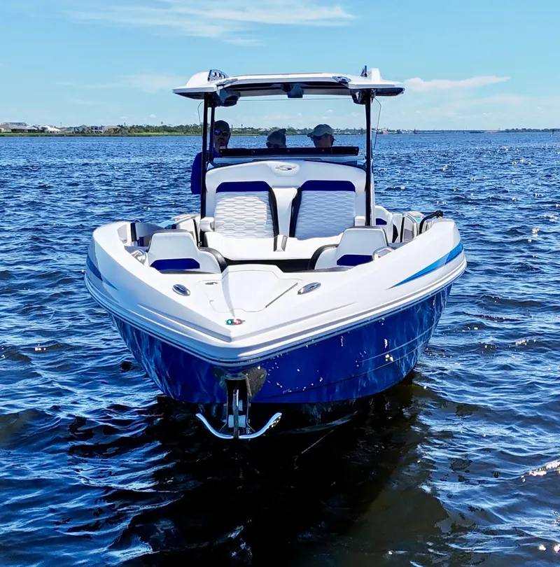 Slide: The Image of 2023 Sunsation 32 CCX boat on water, featuring sleek design and modern seating. - 10