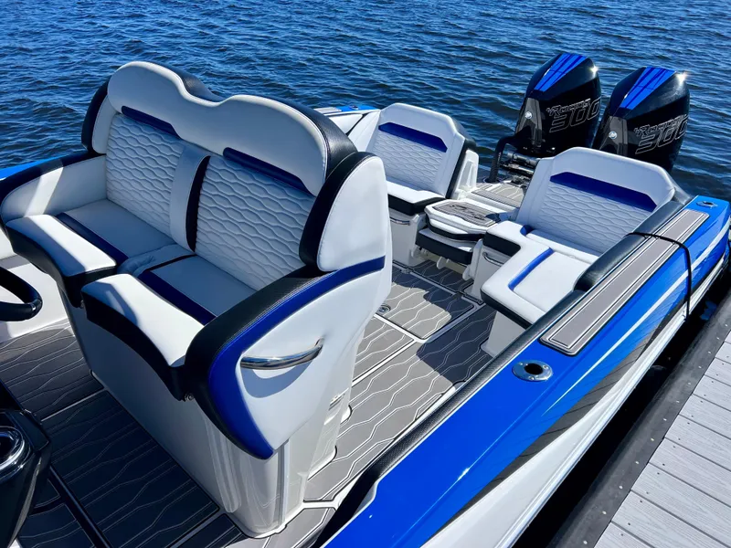 Slide: The Image of 2023 Sunsation 32 CCX boat interior with luxurious seating and powerful engines on the water. - 22