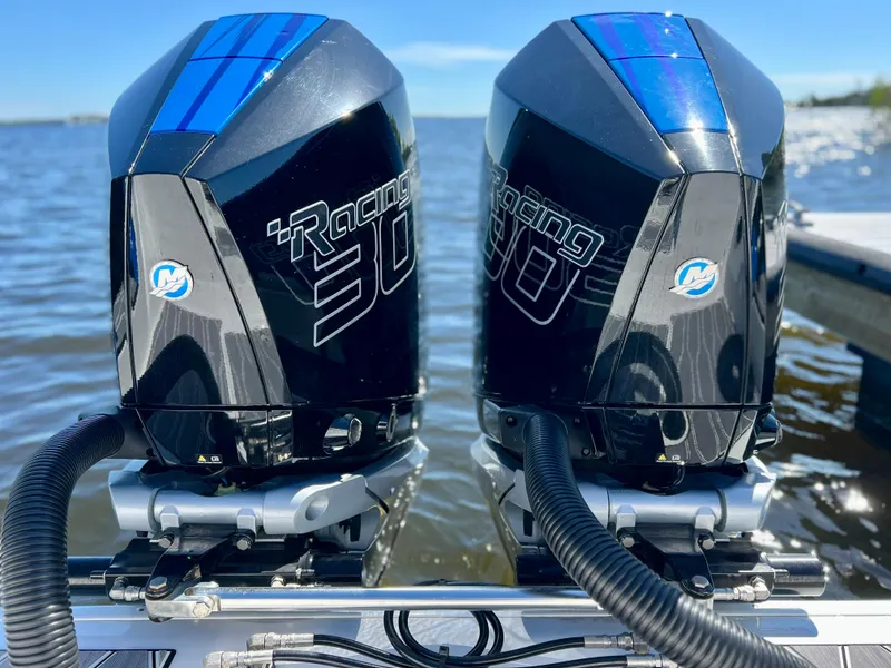 Slide: The Image of Twin Mercury Racing 300 outboard engines on a 2023 Sunsation 32 CCX boat. - 27