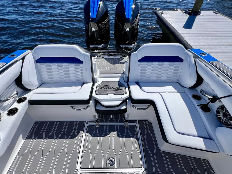 Slide: The Image of 2023 Sunsation 32 CCX boat interior with stylish seating and twin engines by the dock. - 28