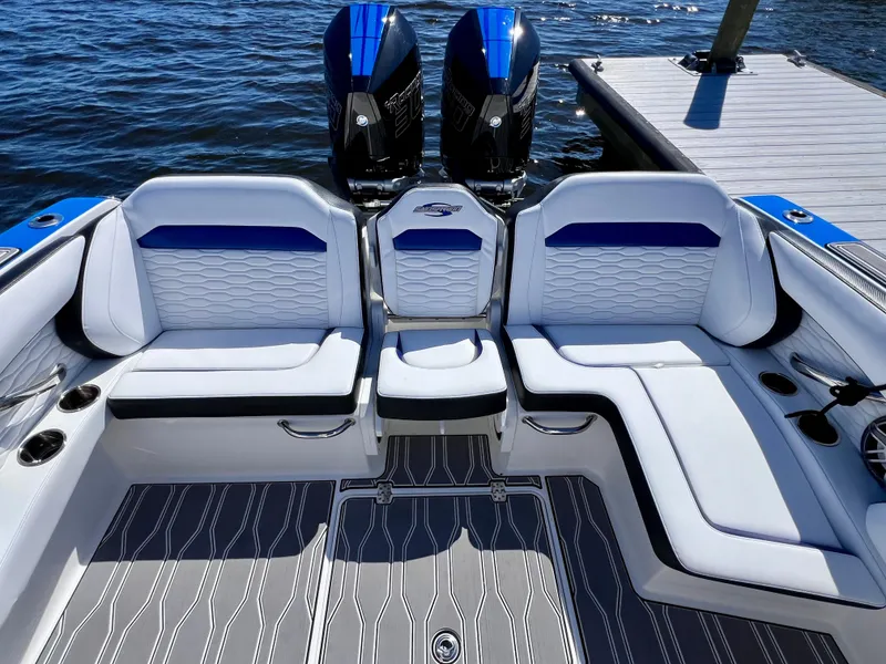 Slide: The Image of 2023 Sunsation 32 CCX boat interior with stylish seating and twin engines. - 29