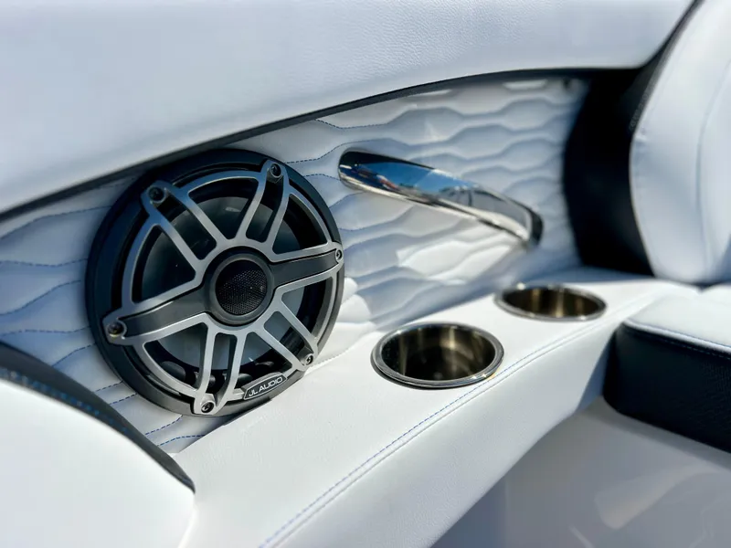 Slide: The Image of 2023 Sunsation 32 CCX interior with JL Audio speaker and cup holders. - 36