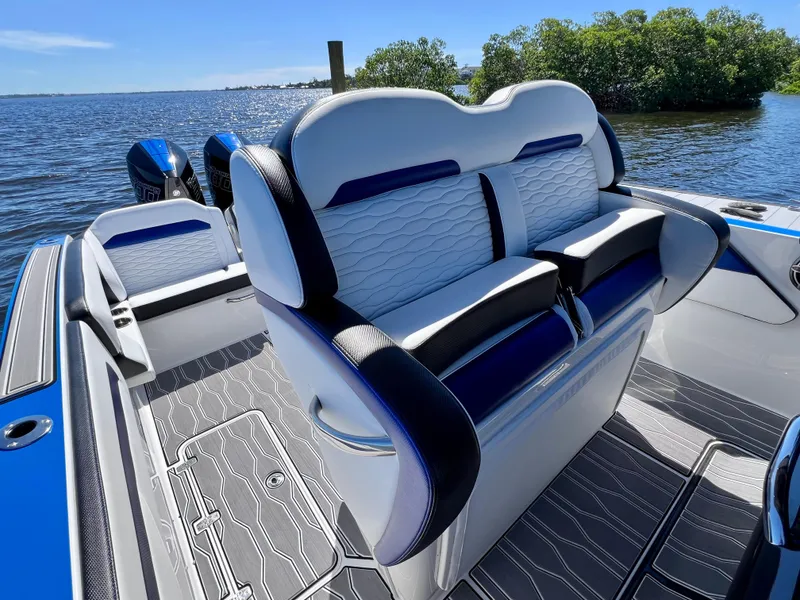 Slide: The Image of 2023 Sunsation 32 CCX boat interior with luxurious seating and scenic water view. - 38