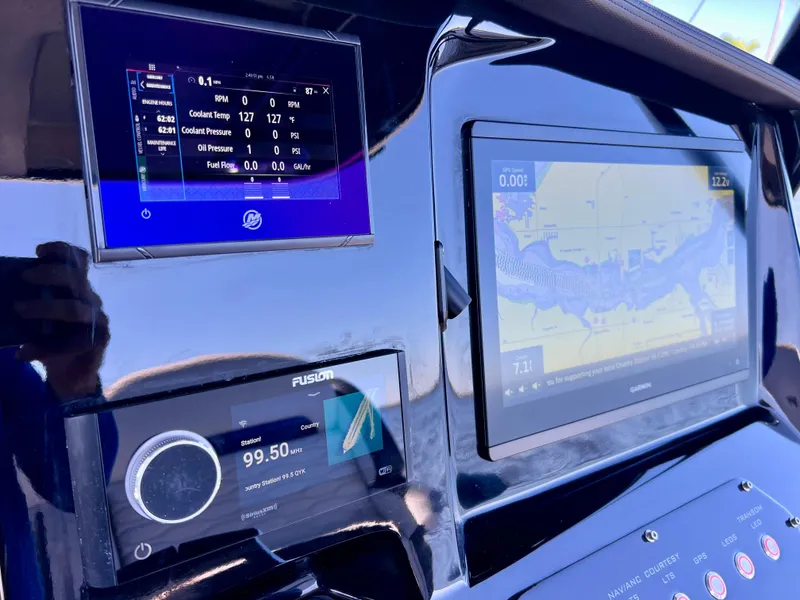 Slide: The Image of Dashboard of 2023 Sunsation 32 CCX with navigation and control displays. - 44