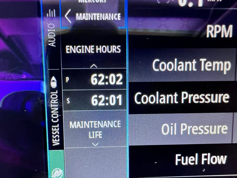 Slide: The Image of Display screen of 2023 Sunsation 32 CCX showing engine hours and maintenance data. - 46