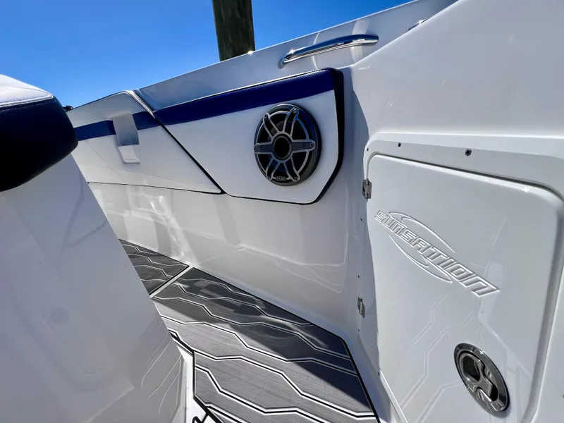 Slide: The Image of 2023 Sunsation 32 CCX boat interior with speaker and sleek design details. - 53