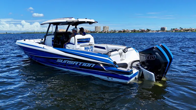 Slide: The Image of 2023 Sunsation 32 CCX boat on water, featuring sleek design and powerful engines. - 7