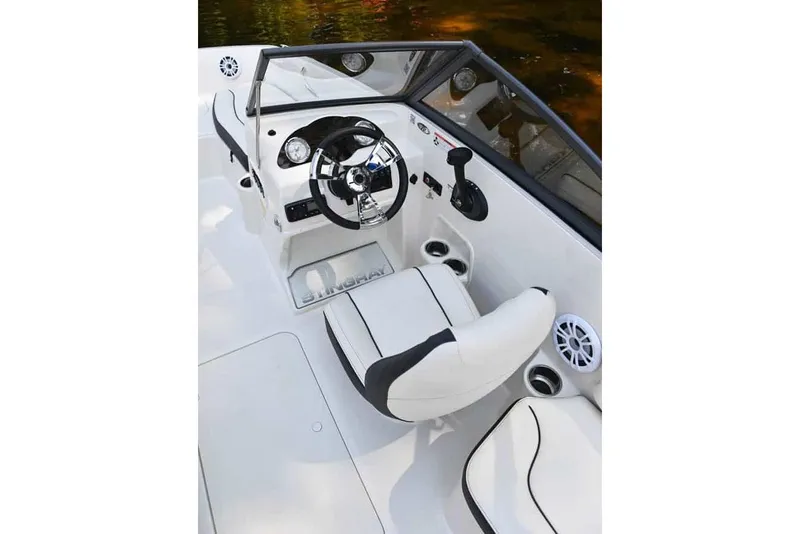 Slide: The Image of Manufacturer Provided Image: 2022 Stingray 191 DC boat cockpit with steering wheel and white seating. - 10