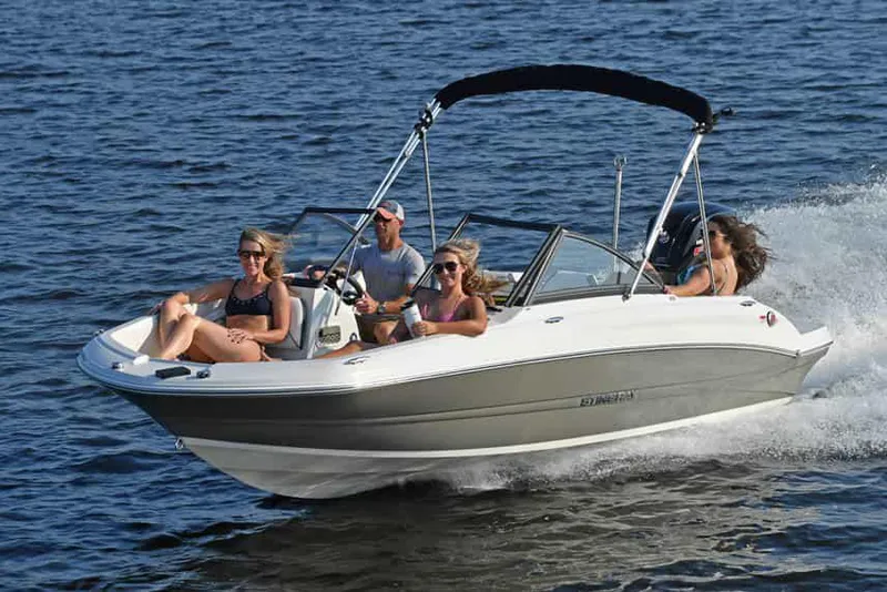 Slide: The Image of Manufacturer Provided Image: 2022 Stingray 191 DC boat cruising with passengers on a sunny day. - 4