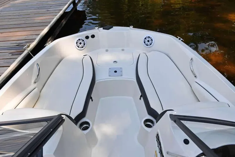 Slide: The Image of Manufacturer Provided Image: 2022 Stingray 191 DC boat interior with white seating and black trim. - 8