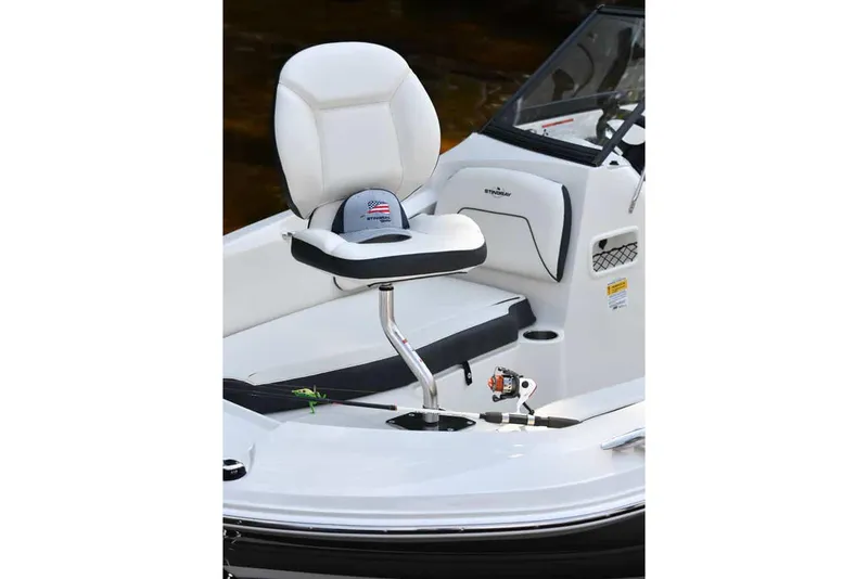Slide: The Image of Manufacturer Provided Image: 2022 Stingray 191 DC boat interior with white captain's chair and dashboard. - 9