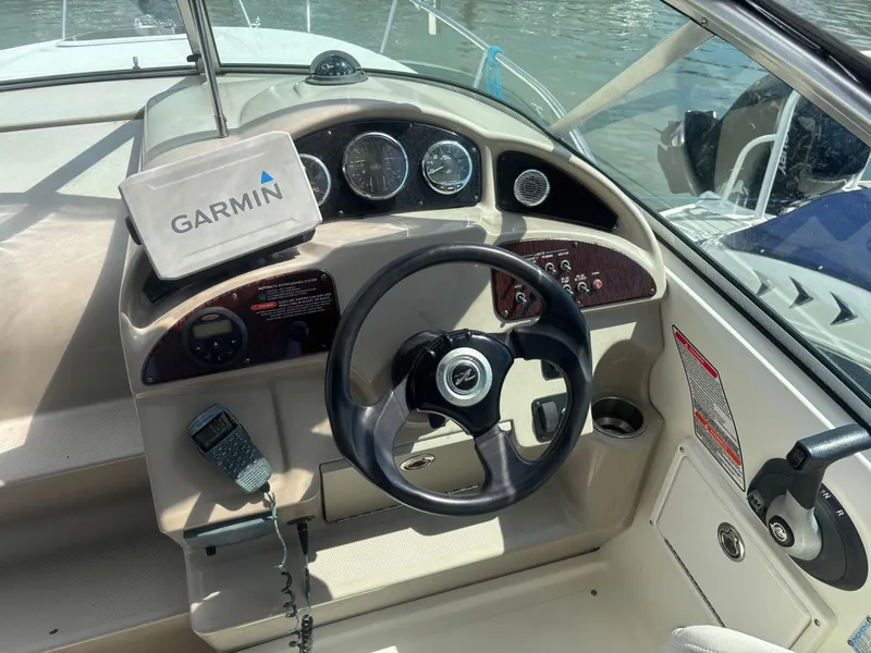 Slide: The Image of 2006 Sea Ray 260 Sundancer helm with Garmin GPS and marine radio. - 14