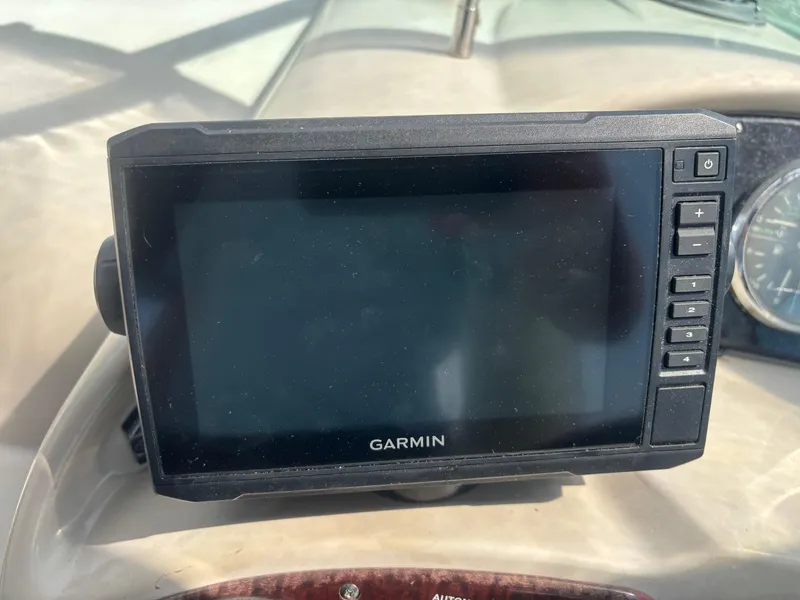 Slide: The Image of Garmin navigation system on 2006 Sea Ray 260 Sundancer boat dashboard. - 15
