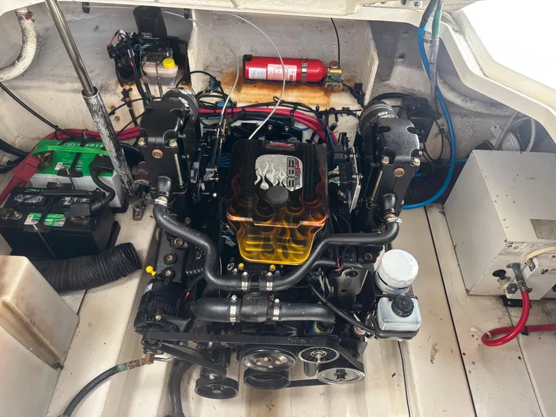 Slide: The Image of Engine compartment of a 2006 Sea Ray 260 Sundancer boat, featuring a detailed engine view. - 30