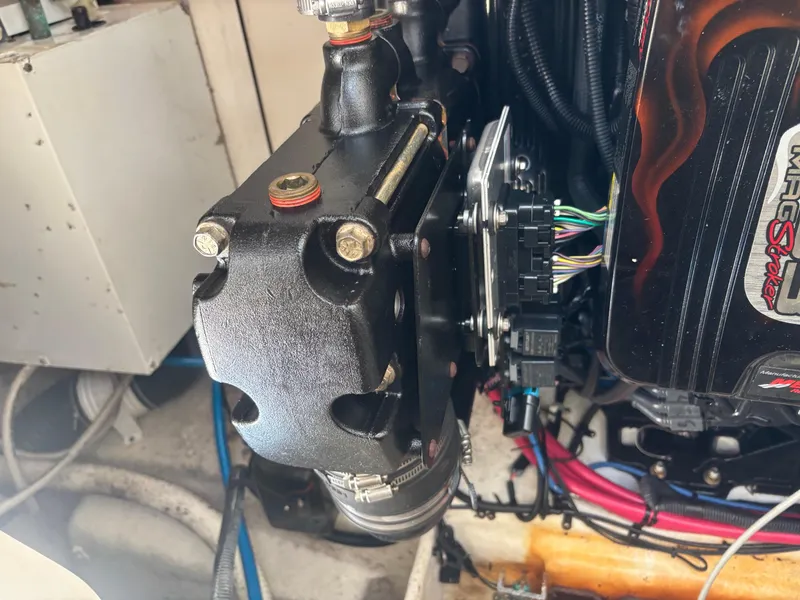 Slide: The Image of Engine compartment of a 2006 Sea Ray 260 Sundancer boat, showing mechanical components. - 33