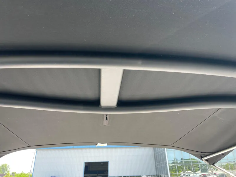 Slide: The Image of Interior view of 2018 Chaparral 267 SSX boat canopy with metal support bars. - 20