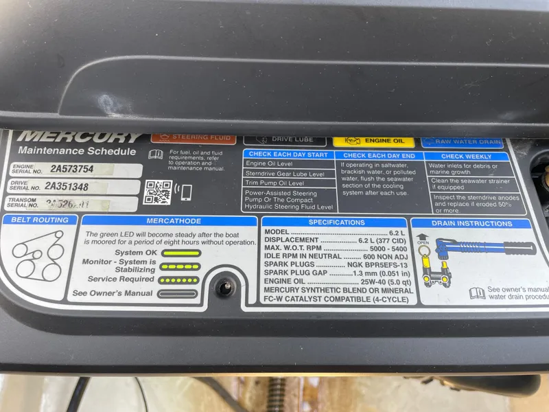 Slide: The Image of Mercury maintenance schedule label on a 2018 Chaparral 267 SSX boat engine. - 22