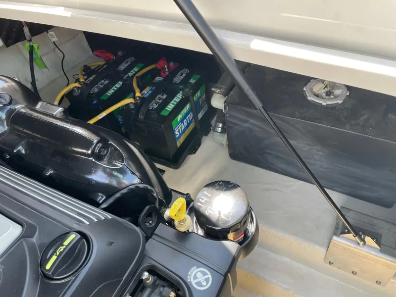 Slide: The Image of Engine compartment of 2018 Chaparral 267 SSX boat with batteries and components. - 24