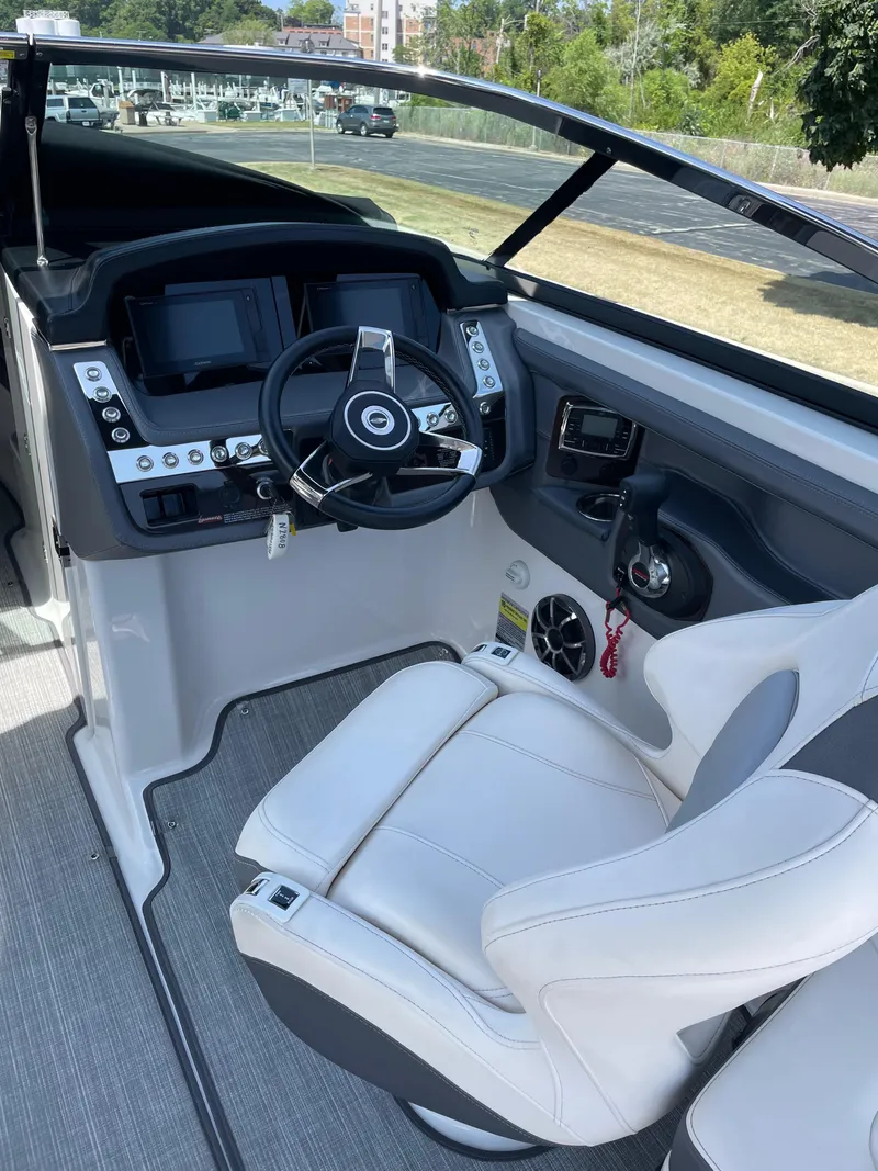 Slide: The Image of 2018 Chaparral 267 SSX boat cockpit with modern steering and controls. - 4