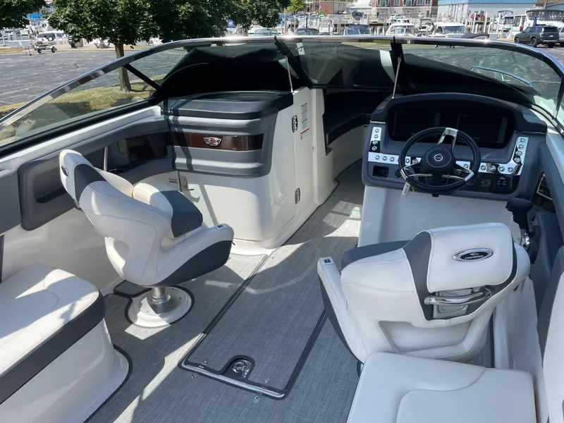 Slide: The Image of 2018 Chaparral 267 SSX boat interior with modern dashboard and seating. - 6