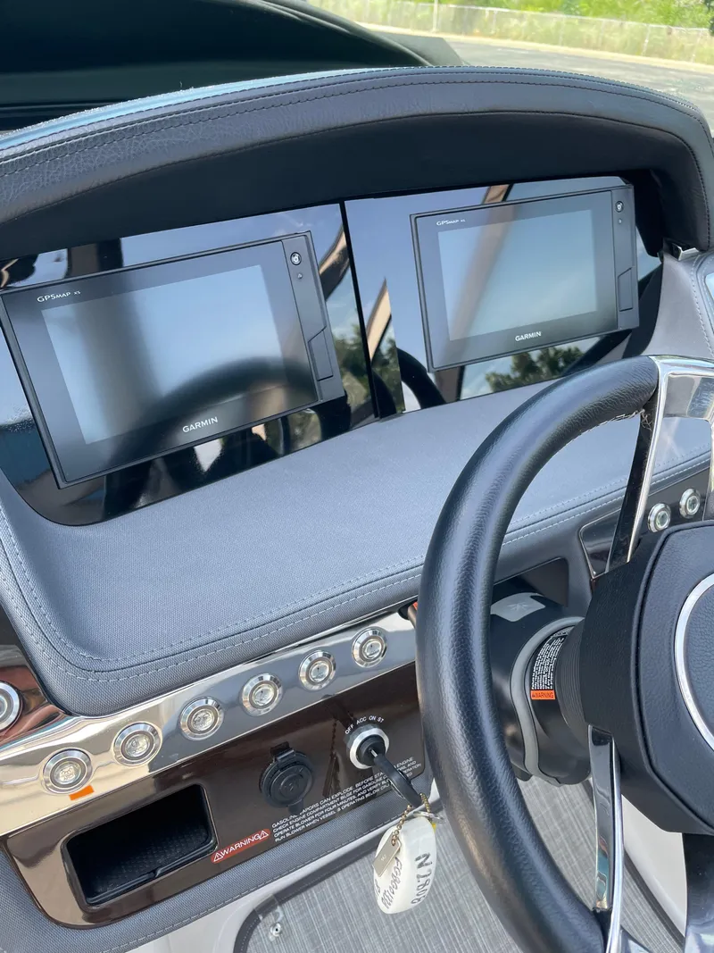 Slide: The Image of Dashboard of 2018 Chaparral 267 SSX boat with dual Garmin displays and steering wheel. - 7