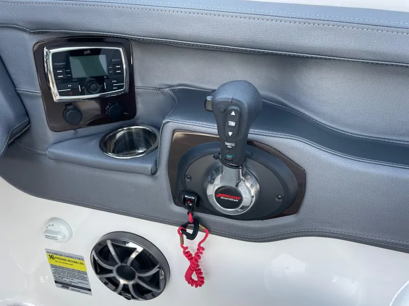 Slide: The Image of Control panel of 2018 Chaparral 267 SSX boat with throttle and audio system. - 8