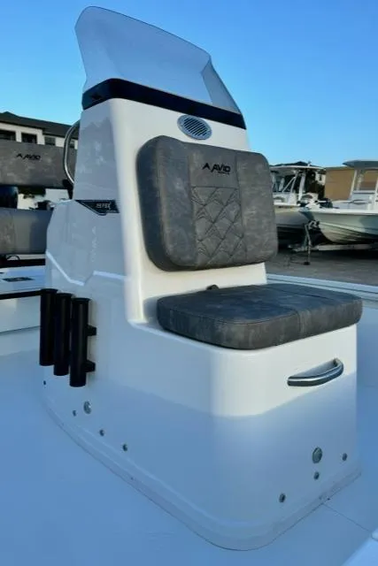 Slide: The Image of Avid 19 FSX 2026 boat seat with gray cushion and windshield. - 10