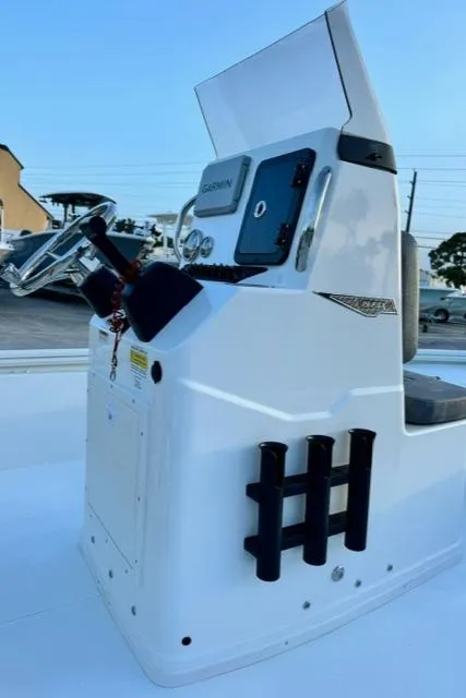 Slide: The Image of Avid 19 FSX 2026 boat console with steering wheel and Garmin display. - 11