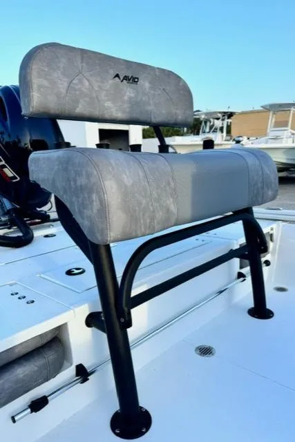 Slide: The Image of Avid 19 FSX 2026 boat seat with gray upholstery and sturdy black frame. - 12