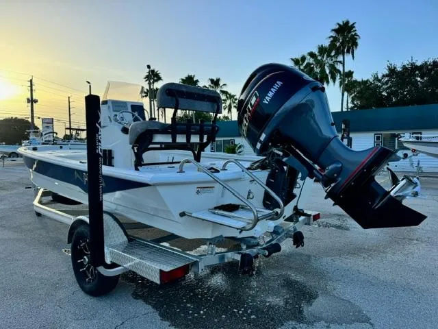 Slide: The Image of 2026 Avid 19 FSX boat with Yamaha outboard motor on a trailer at sunset. - 3