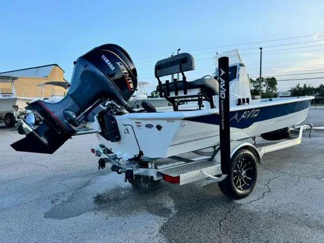 Slide: The Image of 2026 Avid 19 FSX boat with Yamaha engine on trailer in parking lot. - 5