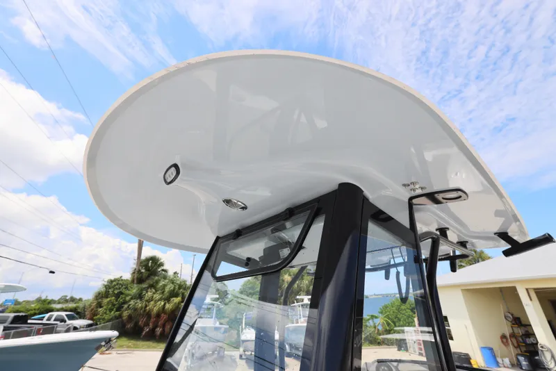 Slide: The Image of 2026 Sea Hunt Gamefish 27 Coffin Box boat, featuring sleek design and modern canopy. - 11