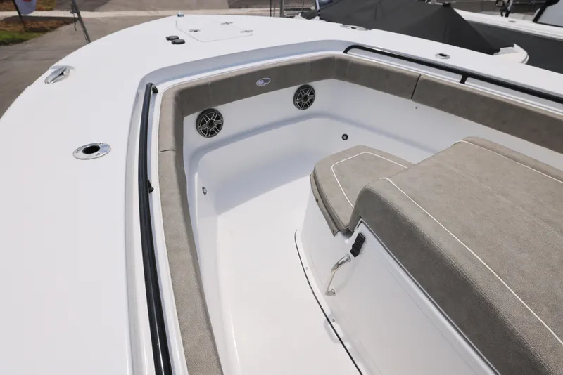 Slide: The Image of 2026 Sea Hunt Gamefish 27 Coffin Box boat interior with cushioned seating and speakers. - 12