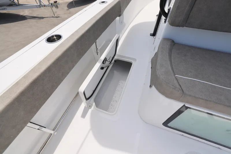 Slide: The Image of 2026 Sea Hunt Gamefish 27 Coffin Box interior with storage compartment and seating. - 14
