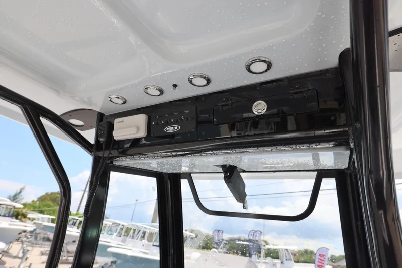 Slide: The Image of 2026 Sea Hunt Gamefish 27 Coffin Box boat console with electronics and controls. - 25