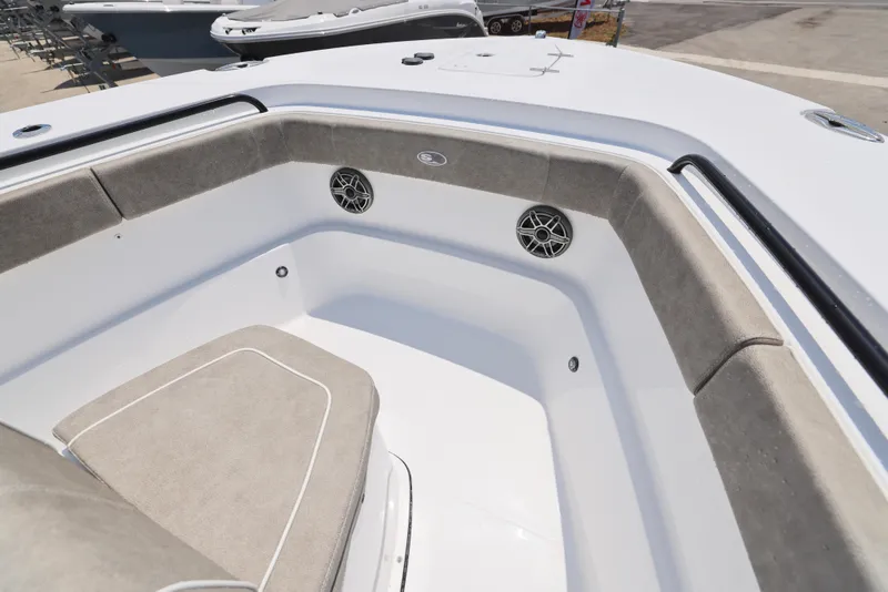 Slide: The Image of 2026 Sea Hunt Gamefish 27 Coffin Box boat interior with cushioned seating and speakers. - 27
